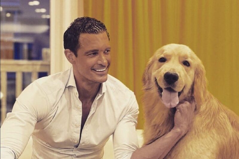Thomas Prommer with his golden retriever
