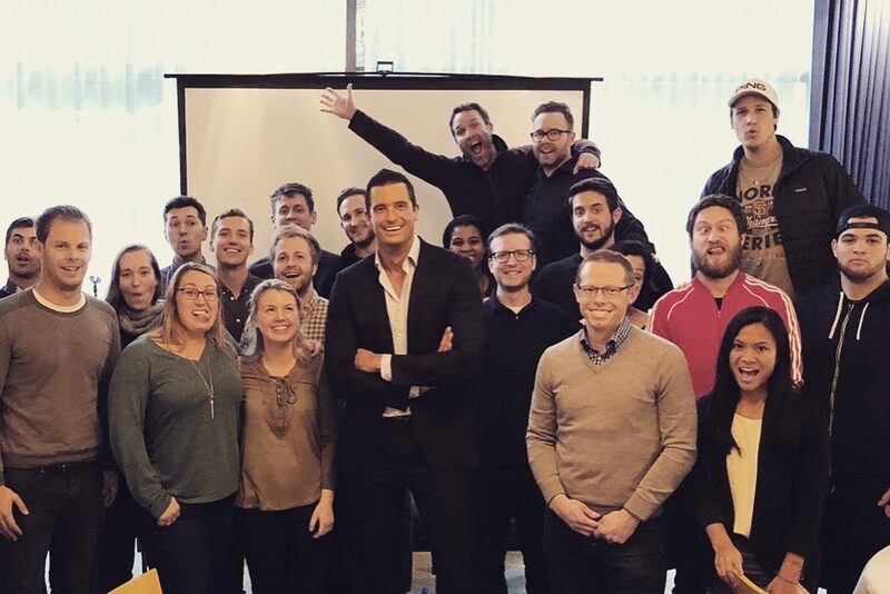 Thomas Prommer with a large group at an event