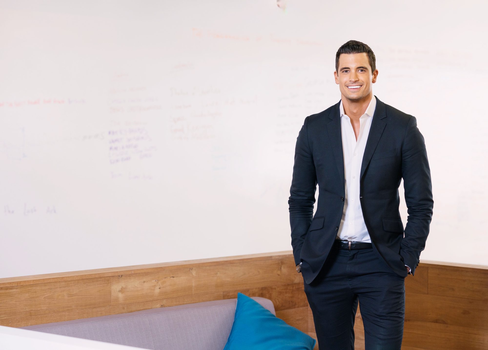 Thomas Prommer standing in an office setting